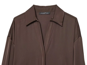 Detailed view of dark coffee satin shirt collar with bead trim and V-neckline