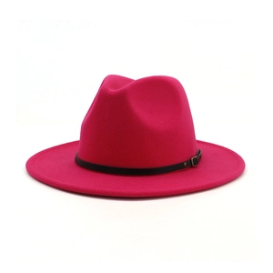 Close-up of fuchsia wool fedora hat with black leather band and metal buckle detail