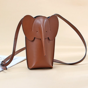 Brown elephant leather crossbody phone bag with adjustable shoulder strap on beige backdrop
