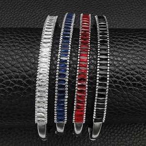 Detailed view of four colorful rectangle zircon bracelets with elegant beaded edges