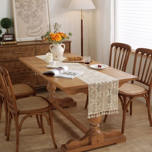 Handmade crochet table runner with beige lace floral patterns and elegant tassels