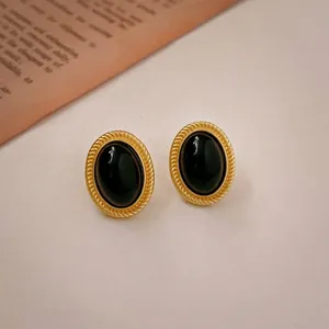Vintage oval geometric necklace with gold rope frame and black stone in French retro style