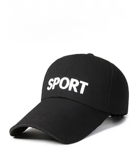 Detailed view of the 3D white SPORT embroidery on a classic black cotton baseball cap