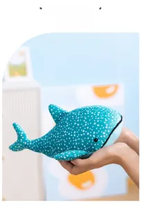 Close-up of blue whale plush toy with white polka dots and soft skin-friendly fabric