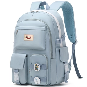 Detail view of light blue nylon backpack with multiple pockets and breathable straps