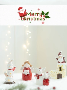 Detailed view of ceramic Christmas figurines set on snow with warm festive lighting