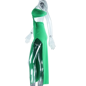 Detail view of green one-shoulder evening dress with side cutout and high leg slit