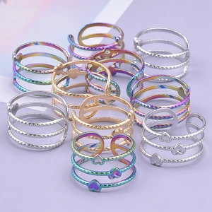 Three-layer stainless steel heart rings in silver, gold and rainbow finishes