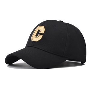 Close-up of the textured pineapple fabric and 3D embroidered C letter on a baseball cap