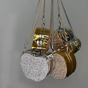 Mini rhinestone evening bags in heart and round shapes with gold and silver finishes