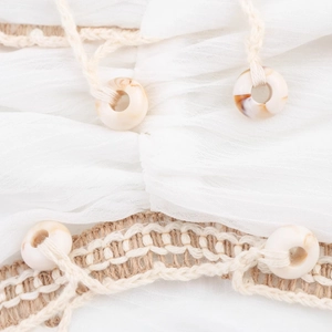 White pleated boho dress set featuring textured fabric with rope fringe and bead accents