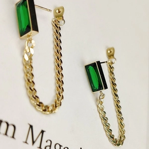 Elegant gold titanium steel tassel earrings with emerald green rectangular gemstones