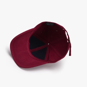 Burgundy cotton baseball cap with distressed details and adjustable metal buckle
