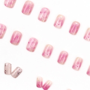 Pink camellia press-on nails with cherry blossom patterns and gold foil flakes