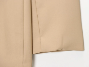 Macro detail of high-density khaki twill fabric texture and professional stitching craft