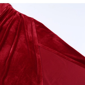 Close-up of the side slit and fine stitching on a premium wine red velvet dress