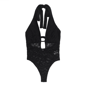Detailed view of the black lace fabric texture and hollow-out mesh on the jumpsuit