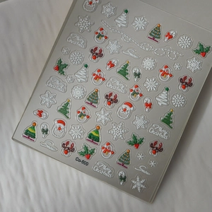 3D embossed Christmas nail art stickers featuring Santa, reindeer, and snowflakes Co-500