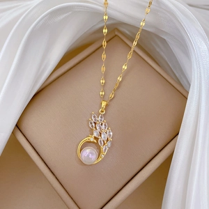 Titanium steel mermaid peacock necklace with crystals and pearl in a jewelry box