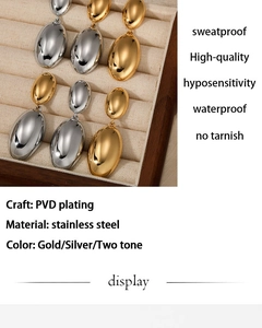 Macro detail of teardrop earrings in polished stainless steel with PVD gold plating