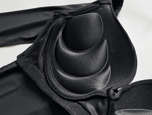 Detailed macro view of the inner black bra cups featuring three-stage massage textures