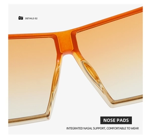 Detail of integrated nose pads on orange gradient cat eye sunglasses for comfort