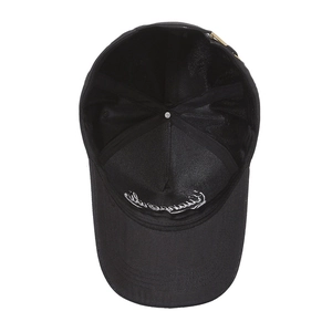 Classic black cotton baseball cap showing internal embroidery and adjustable metal buckle