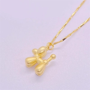 Matte gold S925 silver balloon dog pendant necklace on shimmering twisted chain
