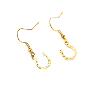 Pair of polished gold stainless steel horseshoe drop earrings on a white background