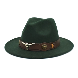 Detail of dark green wide brim wool fedora with brown leather band and silver bull head charm