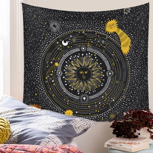 Detailed view of sun and moon tapestry hanging on a bedroom wall with cozy decor