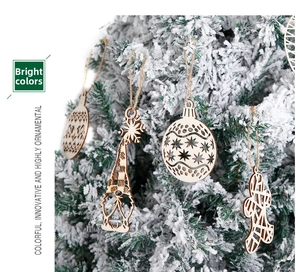Close-up of laser-cut wooden Christmas ornaments with snowflakes hanging on a snowy tree