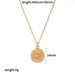 Detail of 18K gold plated stainless steel necklace with sparkling rhinestone sun pendant