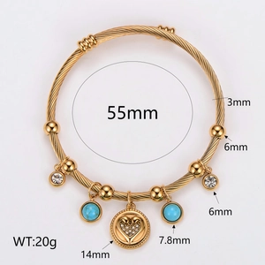 Gold braided stainless steel bangle with turquoise stone and heart charm pendant
