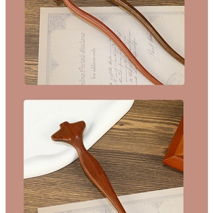 Detailed view of handmade sandalwood hair sticks with natural grain on vintage paper
