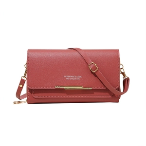 Dark red lychee leather crossbody phone wallet with gold metal bar and adjustable strap