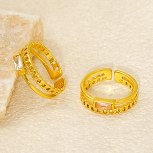 Double-layered gold hollow ring with rectangular crystal and chain design on stone