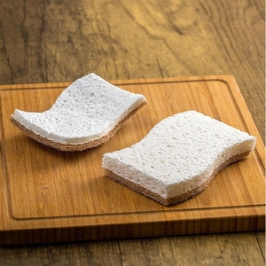 Absorbent wood pulp cotton dish sponge with dual-layer wavy design on wooden board
