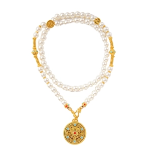 Elegant double-layered pearl necklace with hollow gold disc pendant and turquoise beads