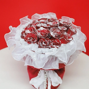Red bouquet of roses with delicate white lace, faux snow coating, and elegant pearl accents
