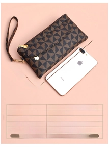 Detail view of plaid PU leather clutch with four zippers and detachable wrist strap