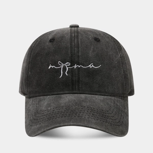 Close-up of vintage washed black cotton baseball cap with white mama bow embroidery