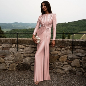 Detail of elegant pink satin evening gown with refined waist pleats and knot design
