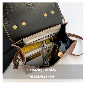 Interior view showing spacious capacity for perfume and lipstick in the embossed bag
