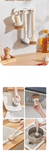 Detail of wall-mounted kitchen brush set for cleaning sinks, pots, and boards