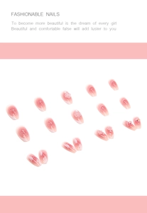 Detail showing pink gradient press-on nails with 3D relief roses and pearl decorations