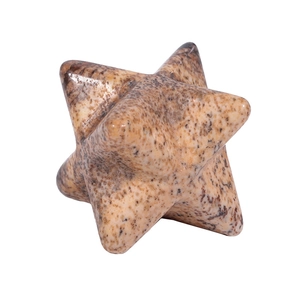 Macro shot of natural stone Merkaba star with smooth polished surface and brown spots