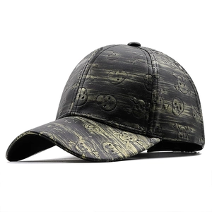 Faux leather baseball cap with gold brushed finish and embossed skull patterns