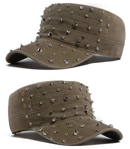 Detail of vintage military cap with star-shaped metal studs and washed canvas fabric