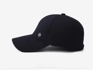 Detail of wool baseball cap showing thick fiber texture and sport metal logo on side